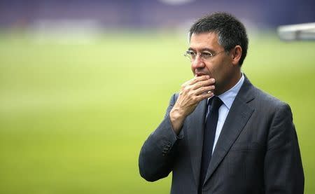 FC Barcelona president Josep Maria Bartomeu attends a training session at Joan Gamper training camp, near Barcelona July 25, 2014. REUTERS/Albert Gea