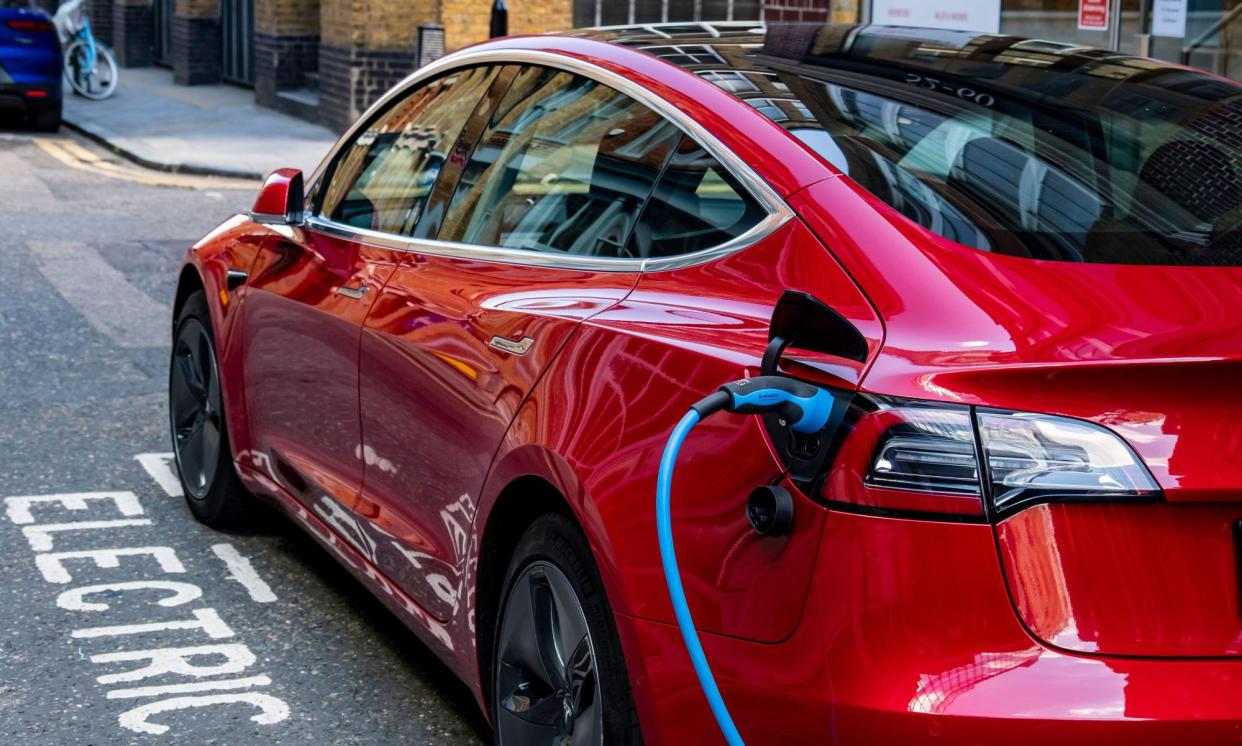 <span>Higher-mileage Tesla Model 3s with long-range batteries can be bought for less than £15,000.</span><span>Photograph: William Barton/Alamy</span>