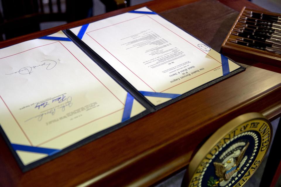 The farm bill signed by President Barack Obama is seen at Michigan State University, in East Lansing, Mich., on Friday, Feb. 7, 2014. (AP Photo/Jacquelyn Martin)