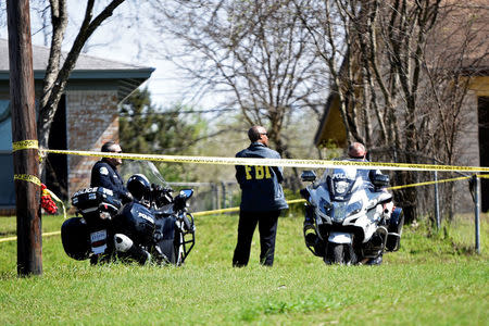 Police and FBI officers guards the scene of an explosion in Austin, Texas, U.S., March 12, 2018. REUTERS/Sergio Flores