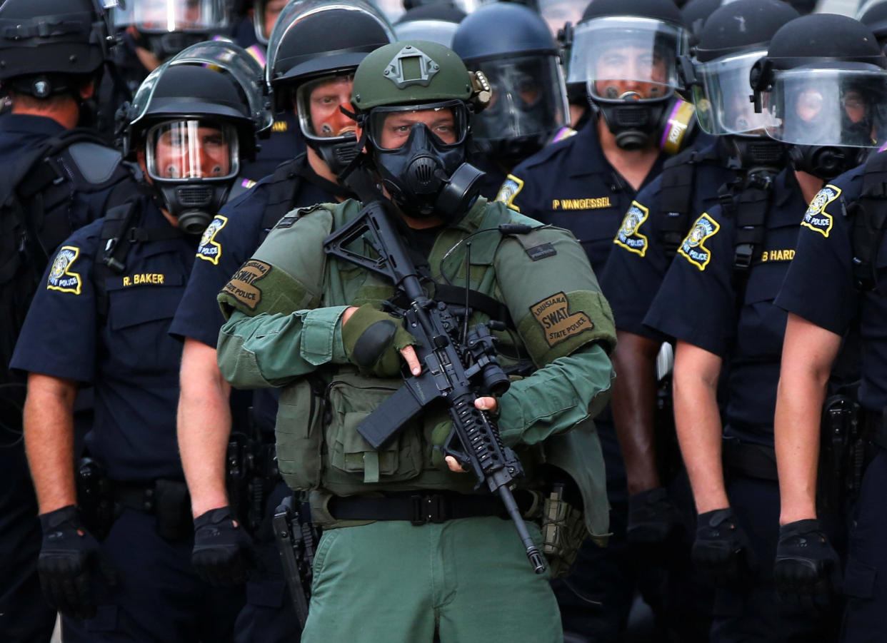 Law officers stand on a street during protests in Baton Rouge, Louisiana, U.S.,  July 10, 2016.  REUTERS/Shannon Stapleton