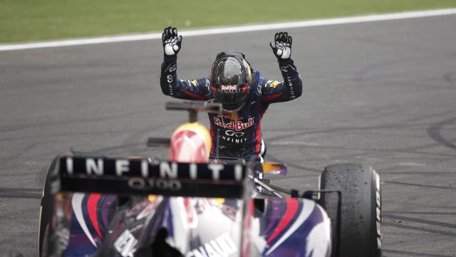 Red Bull driver Sebastian Vettel of Germany celebrates on his car