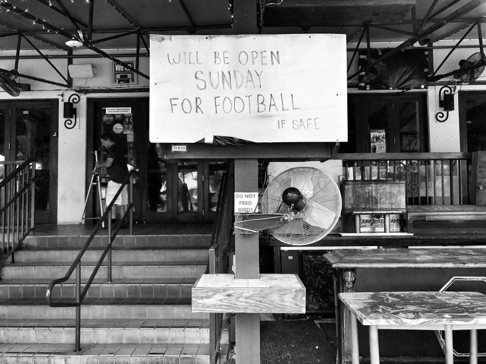 <p>A sign outside Finnegan’s Bar Saturday in Miami Beach. (Photo: Holly Bailey/Yahoo News) </p>