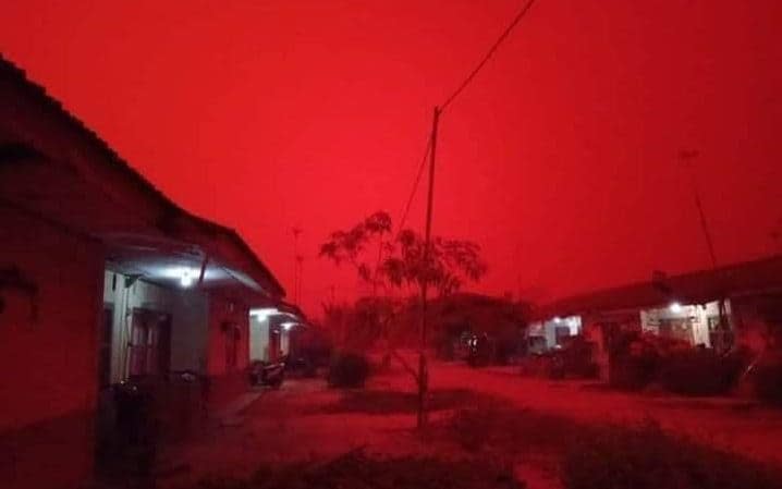 Indonesian skies have turned an eerie red because of forest fires