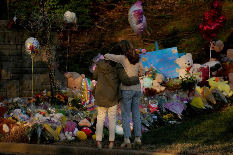 FILE PHOTO: People visit a memorial after deadly shooting at the Covenant School in Nashville