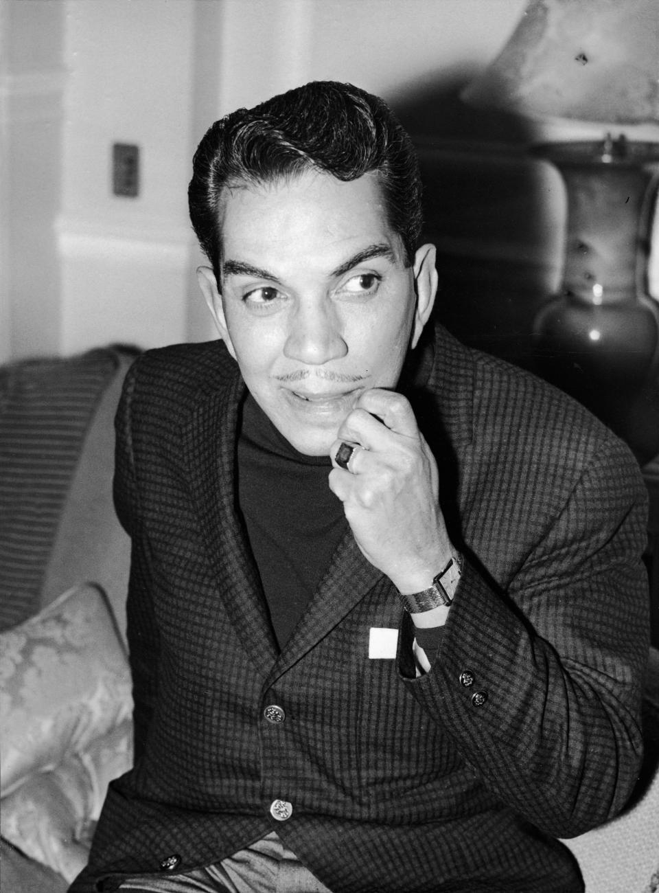 Mexican comedian Cantinflas (1911 - 1993) looks thoughtful as he sits in his London hotel room before meeting actors for his new film 'Pepe,' London, England, April 26, 1959. The versatile producer/writer/actor/singer, reputed to be the highest paid entertainer in the world, gained international fame with his role as Passepartout in the 1956 film 'Around the World in 80 Days.' (Photo by FPG/Getty Images)