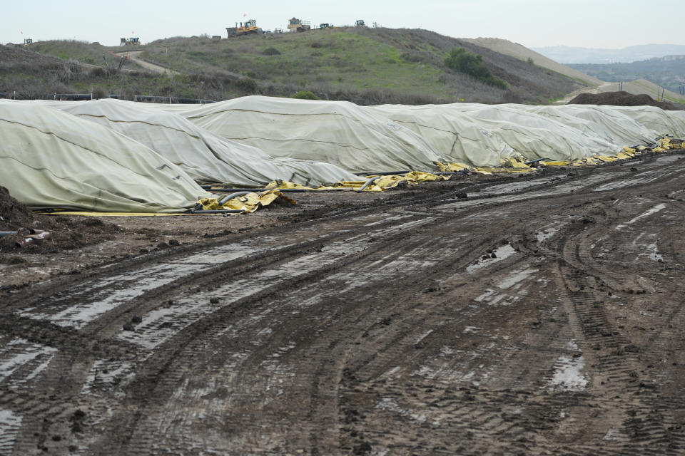 Compost piles are cured at the Otay Landfill in Chula Vista, Calif., on Friday, Jan. 26, 2024. Two years after California launched an effort to keep organic waste out of landfills, the state is so far behind on getting food recycling programs up and running that it's widely accepted next year's ambitious waste-reduction targets won't be met. (AP Photo/Damian Dovarganes)