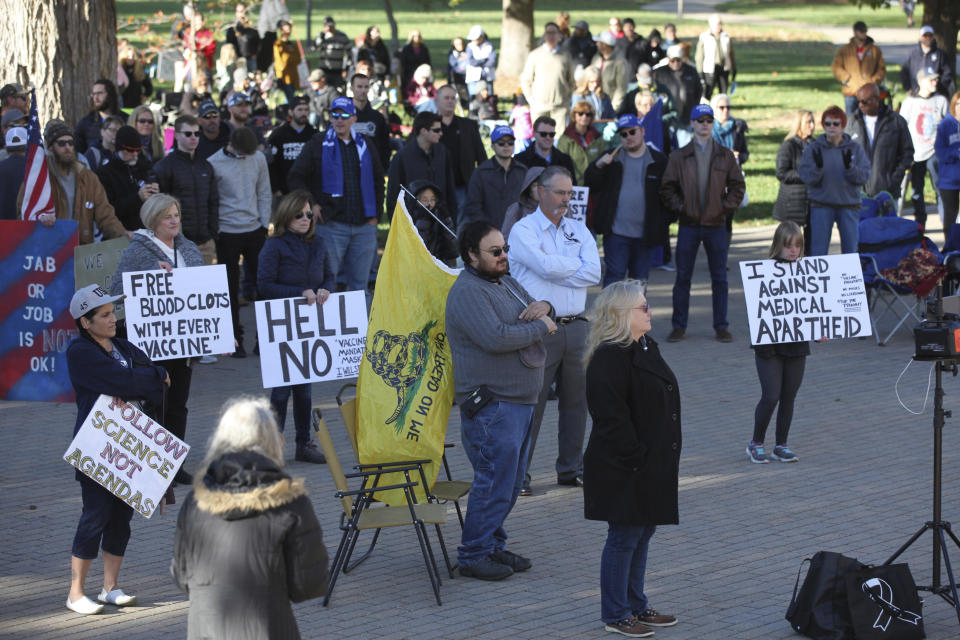 Several hundred people who oppose President Joe Biden's COVID-19 vaccine mandates rally outside the Kansas Statehouse, Saturday, Oct. 30, 2021, in Topeka, Kan. They've been encouraged by Republican legislators who believe the mandates will spur higher turnout among conservative voters. (AP Photo/John Hanna)