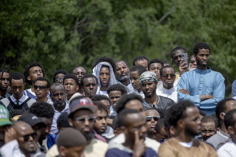 Crowds of women and men attend the funeral of the five people killed in a car crash on Lake Street, at the Garden of Eden Islamic Cemetery in Burnsville, Minn., on Monday, June 19, 2023. (Elizabeth Flores/Star Tribune via AP)