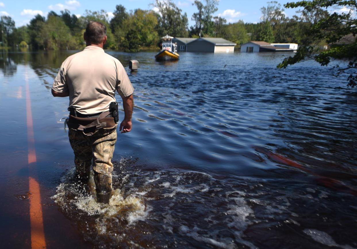 Lt. Keith Ramsey with the Pender County Sheriff's Office helps rescue efforts in Burgaw, North Carolina, in September 2018 after floodwaters from Hurricane Florence swamped much of eastern North Carolina.