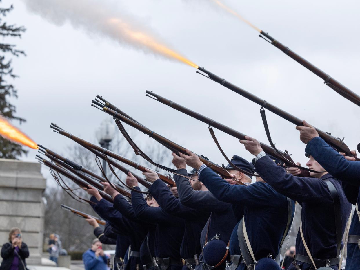 Civil War re-enactors from Company G of the 29th Ohio Infantry out of Summit County fire a gun salute at the McKinley wreath laying ceremony in Canton Saturday.