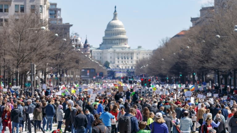 Signs carried by protestors lambasted lawmakers who oppose tougher laws and the National Rifle Association (NRA), the powerful US gun lobby