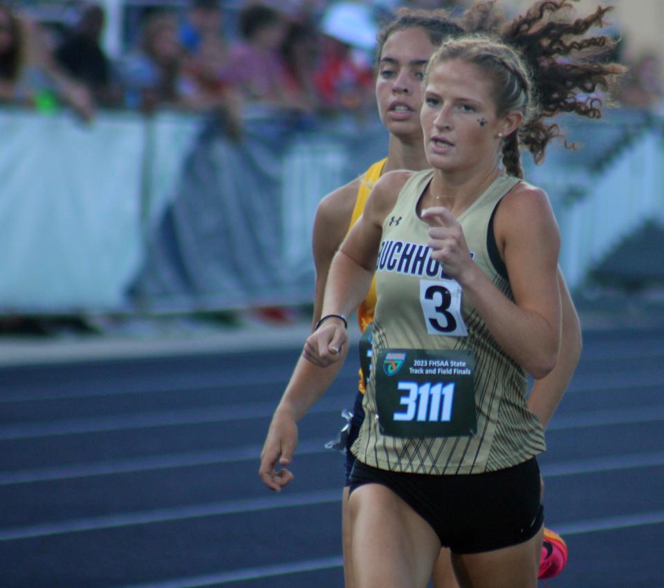 Kate Drummond of Gainesville Buchholz (3111) and Grace Finneran of St. Thomas Aquinas race in the girls 1,600-meter run  during the FHSAA Class 4A high school track and field championship in Jacksonville on May 20, 2023. [Clayton Freeman/Florida Times-Union]