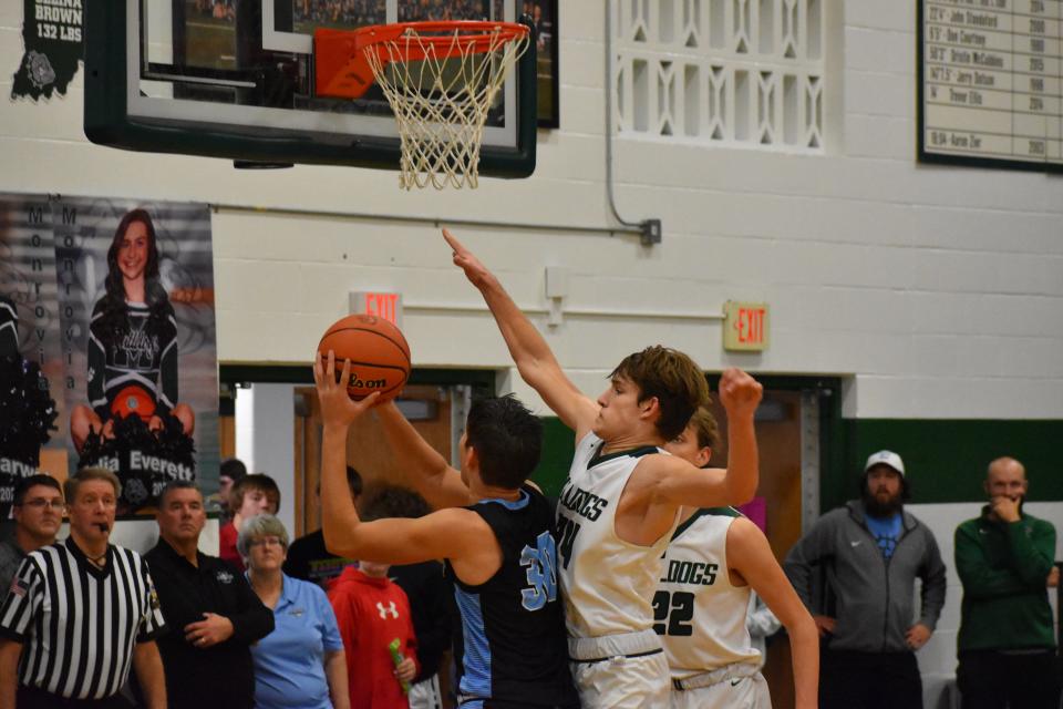 Monrovia's Gaven Followell contests Cascade's Makye Tharp's shot during their game on Dec. 3, 2021.