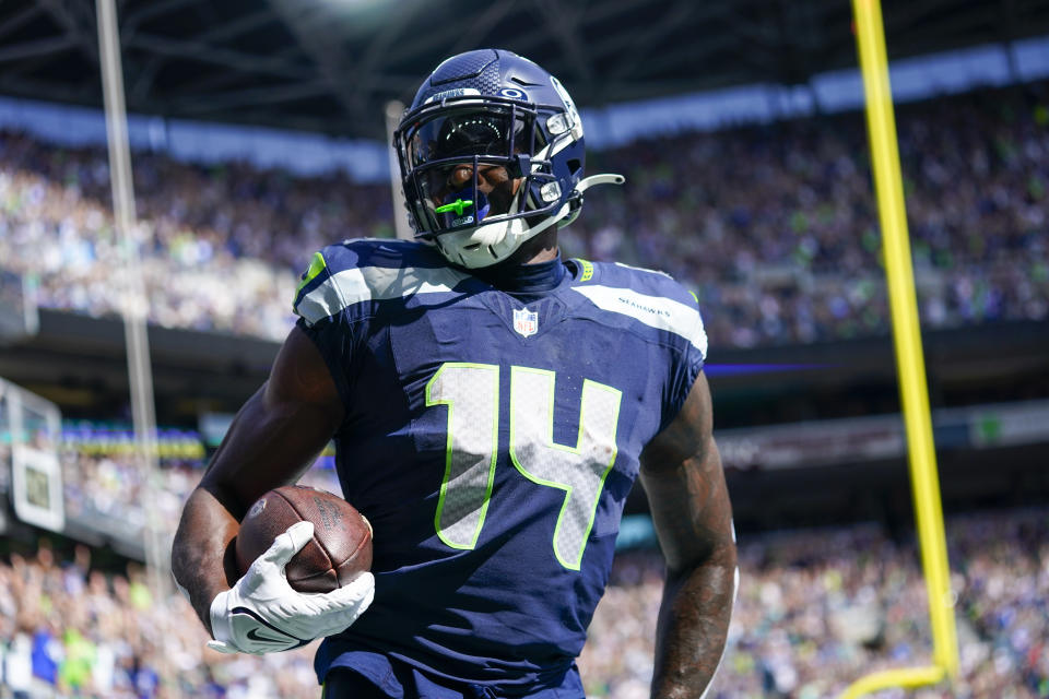 Seattle Seahawks wide receiver DK Metcalf celebrates after scoring against the Los Angeles Rams during the first half of an NFL football game Sunday, Sept. 10, 2023, in Seattle. (AP Photo/Lindsey Wasson)