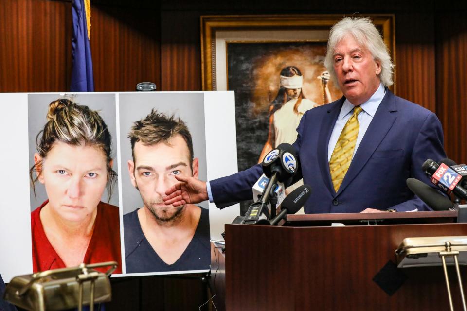 Geoffrey Fieger, the lawyer of Jeffrey and Brandi Franz who are parents of Riley and Bella Franz, gestures to a photo of James and Jennifer Crumbley, who are the parents of Oxford High School Shooter Ethan Crumbley, as he holds a press conference to announce the two federal $100 million lawsuit he has filed in their name at his office in Southfield on Dec. 9, 2021.