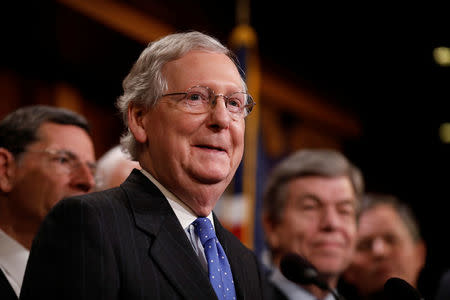 Senate Majority Leader Mitch McConnell, accompanied by members of the Republican Conference, speaks at a news conference about the passage of the Tax Cuts and Jobs Acts at the U.S. Capitol in Washington, U.S., December 20, 2017. REUTERS/Aaron P. Bernstein
