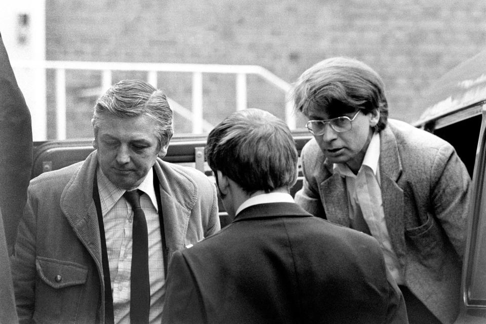 Civil Servant Dennis Nilsen, right, charged with murdering fifteen men, arrives at Highgate Magistrates Court.