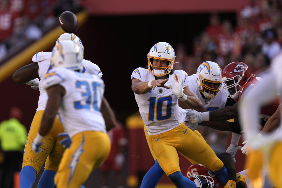 Los Angeles Chargers quarterback Justin Herbert (10) throws during the first half of an NFL football game against the Kansas City Chiefs Sunday, Oct. 22, 2023, in Kansas City, Mo. (AP Photo/Charlie Riedel)
