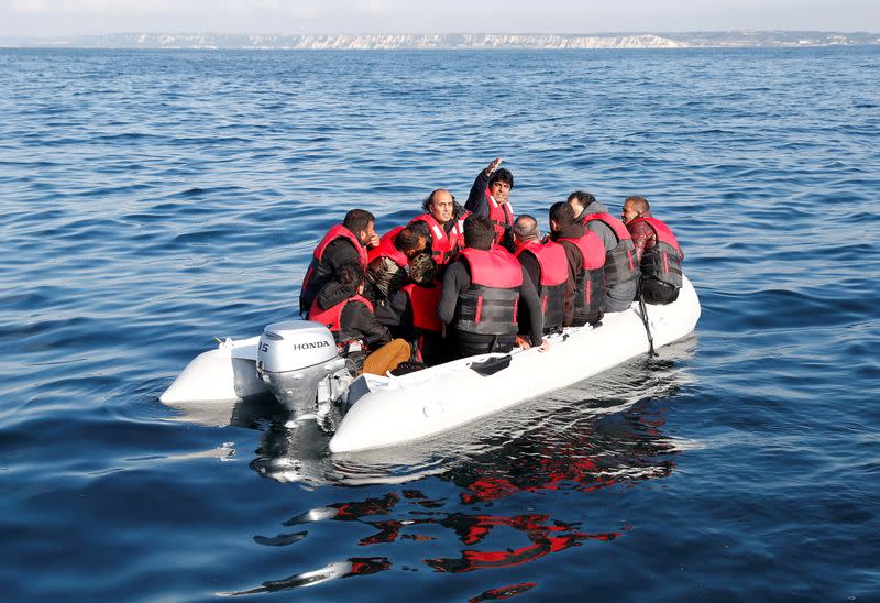 Migrants who launched from the coast of northern France cross the English Channel in an inflatable boat near Dover