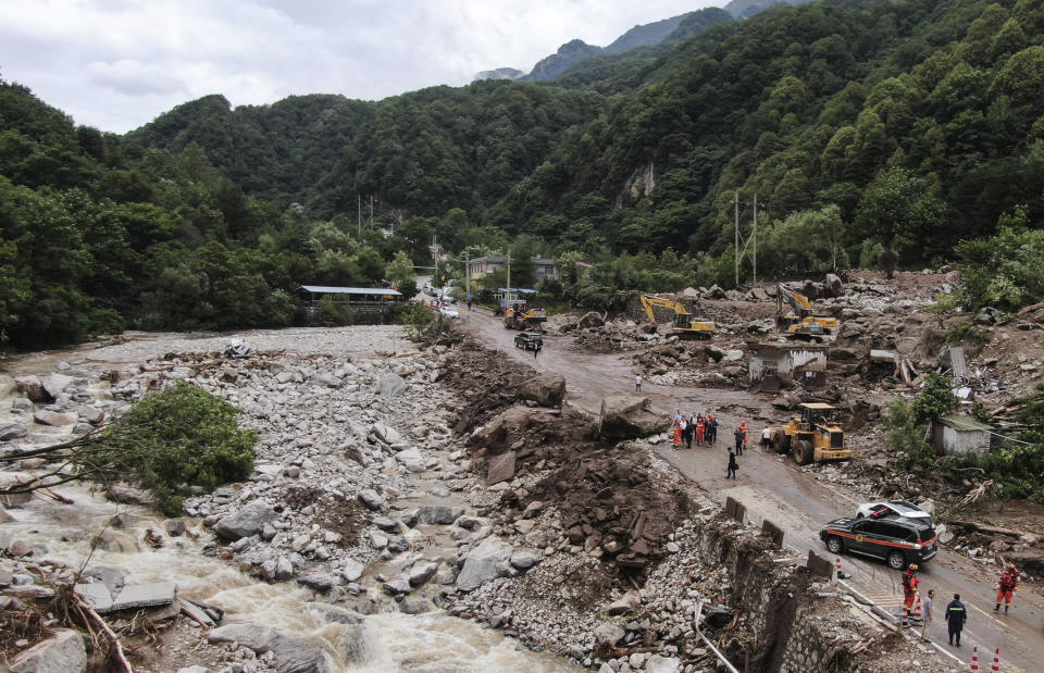 In this photo released by Xinhua News Agency, an aerial photo shows the aftermath of a mudslide in Weiziping village of Luanzhen township on the outskirts of Chang'an district, Xi'an of northwestern China's Shaanxi Province on Saturday Aug. 12, 2023. The mudslide caused by torrential rains killed multiple people on the outskirts of Xi'an in western China, an official news agency said Saturday, while some trains in the northeast were canceled as a powerful storm lashed the region. (Zou Jingyi/Xinhua via AP)