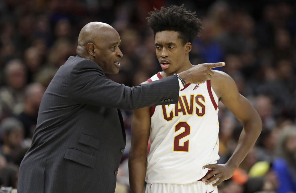 Cleveland Cavaliers coach Larry Drew talks with Collin Sexton during the second half of an NBA basketball game against the Oklahoma City Thunder, Wednesday, Nov. 7, 2018, in Cleveland. The Thunder won 95-86.(AP Photo/Tony Dejak)