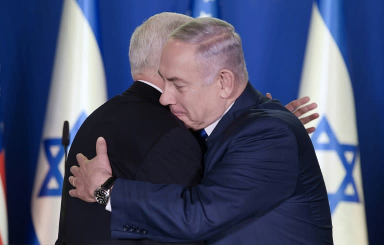 Vice President Mike Pence (L) embraces Israeli Prime Minister Benjamin Netanyahu on January 22, 2018 during a visit to Jerusalem in which he pledged to move the US embassy to the disputed city by the end of 2019