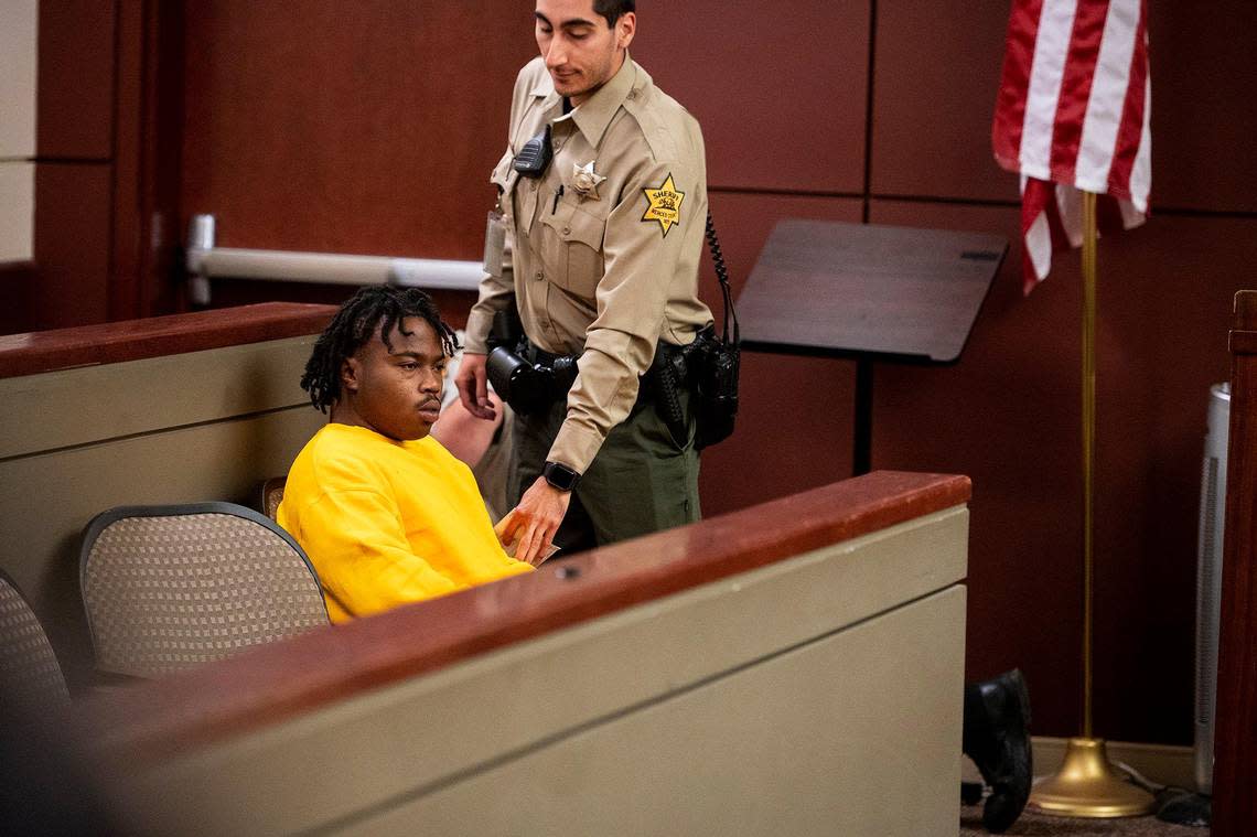 A Merced County Sheriff Deputy stands near Daevon Jamari Motshwane, 18, as another deputy wrestles an inmate who attacked Motshwane to the floor in Merced County Superior Court in Merced, Calif., on Thursday, Dec. 1, 2022. Motswhane appeared before Judge Carol Ash and has been charged with murder in the shooting death of 9-month-old Darius King Grigsby.