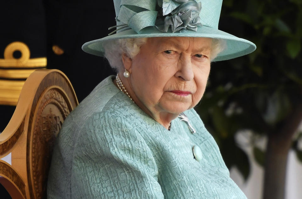 Britain's Queen Elizabeth II during a ceremony to mark her official birthday at Windsor Castle in Windsor, England, Saturday June 13, 2020. Queen Elizabeth II’s birthday is being marked with a smaller ceremony than usual this year, as the annual Trooping the Color parade is canceled amid the coronavirus pandemic. The Queen celebrates her 94th birthday this year. (Toby Melville/Pool via AP)