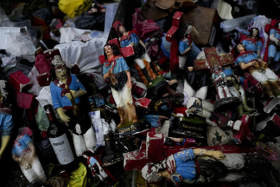 Broken figures of Argentina's folk Saint "Gauchito" Gil lie on the grass at his sanctuary in Mercedes, Corrientes, Argentina, Sunday, Jan. 7, 2024. Every Jan. 8, devotees from across the country visit his sanctuary to ask for miracles or give him thanks.(AP Photo/Natacha Pisarenko)