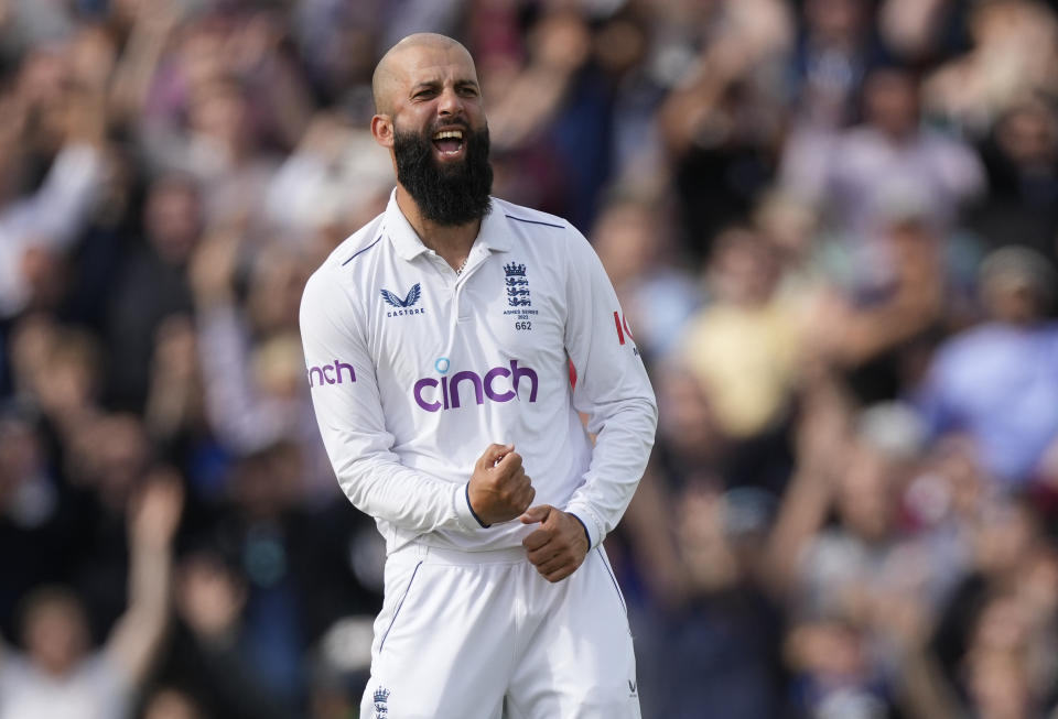 England's Moeen Ali celebrates the dismissal of Australia's Mitchell Marsh on day five of the fifth Ashes Test match between England and Australia, at The Oval cricket ground in London, Monday, July 31, 2023. (AP Photo/Kirsty Wigglesworth)