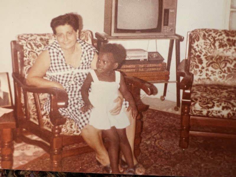 An undated handout image shows Kholoud Yagoob Abdallah when she was a toddler with her adopted family member in Beirut An undated handout image shows a Sudanese woman trapped in Khartoum