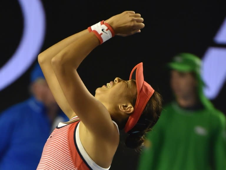 China's Zhang Shuai celebrates victory against Madison Keys of the United States at the Australian Open