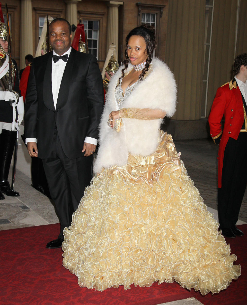 the king and one of his wives attending a formal event