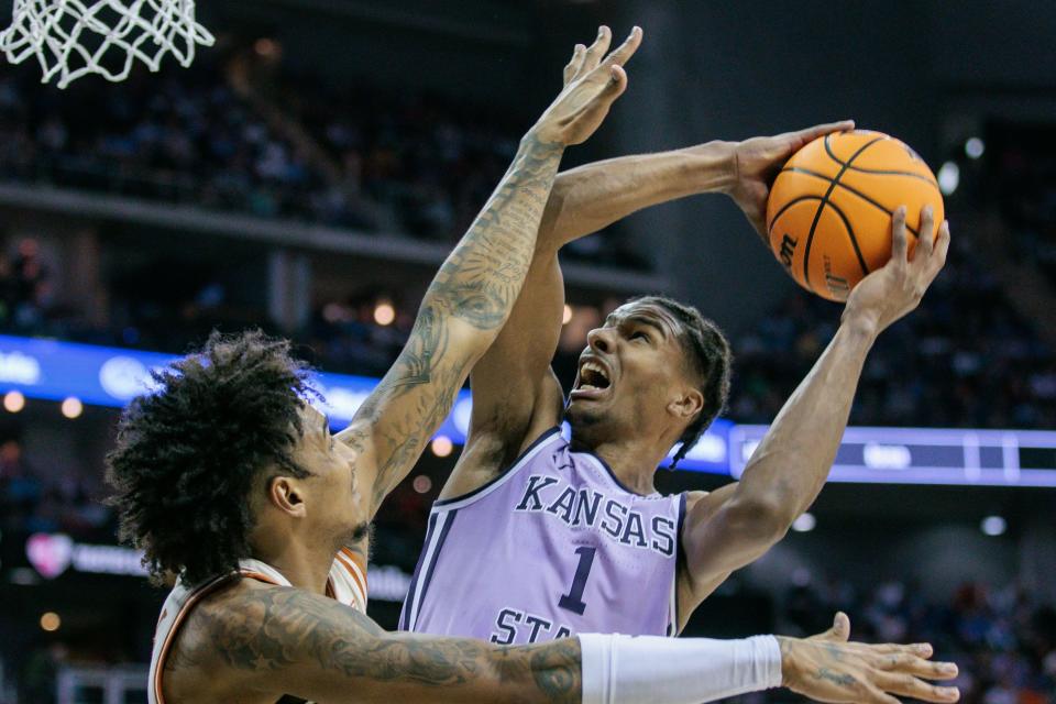 Kansas State forward David N'Guessan takes a shot in the second half. The Wildcats' 78-74 win over Texas could help their NCAA Tournament chances. Selection Sunday is this weekend, and Texas hopes its season résumé is strong enough for a No. 8 or No. 9 seed.