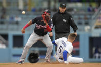 Los Angeles Dodgers first baseman Freddie Freeman (5) steals second base ahead of a throw to Washington Nationals second baseman Luis Garcia (2) during the third inning of a baseball game in Los Angeles, Wednesday, May 31, 2023. (AP Photo/Ashley Landis)