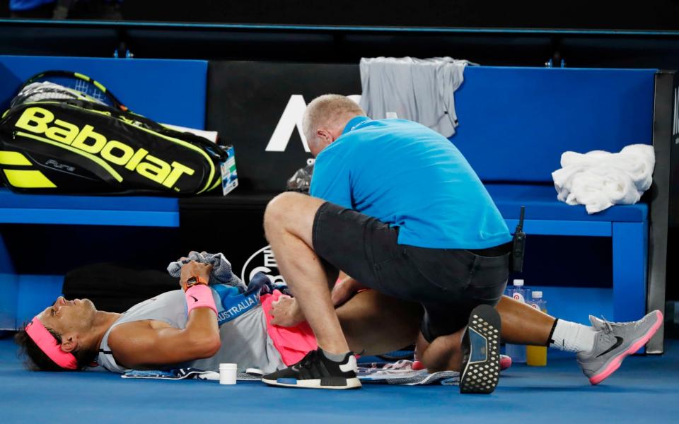 Nadal receives a medical time-out during the fourth set against Cilic - REUTERS