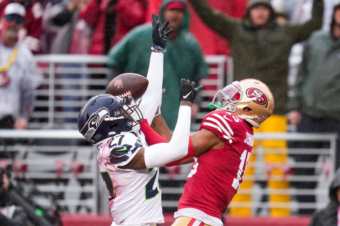 Seattle Seahawks cornerback Tariq Woolen, left, breaks up a pass intended for San Francisco 49ers wide receiver Jauan Jennings during the first half of an NFL wild card playoff football game in Santa Clara, Calif., Saturday, Jan. 14, 2023. (AP Photo/Godofredo A. Vásquez)