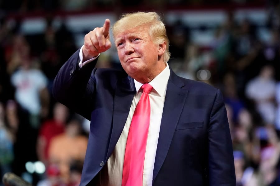 FILE – Former President Donald Trump points to the crowd as he arrives to speak at a rally July 22, 2022, in Prescott, Ariz. Trump is returning to Washington for the first time since leaving office to deliver a policy speech Tuesday night, July 26 before allies who have been crafting an agenda for a possible second term. Trump will address the America First Policy Institute’s two-day America First Agenda Summit. (AP Photo/Ross D. Franklin, File)