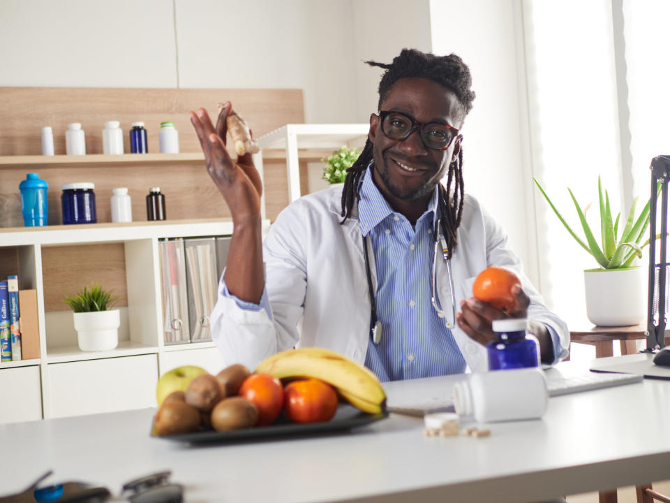 person with a bowl of fruit in front of them