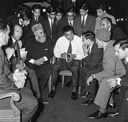 Muhammad Ali (formerly Cassius Clay) speaks to Muslims holding a book called Towards Understanding Islam written by Sayyid Abul Ala Maududi in London, Britain in May 1966. Ali was in London for of his rematch with British Heavyweight Henry Cooper. Mandatory Credit: Action Images / MSI/File Photo