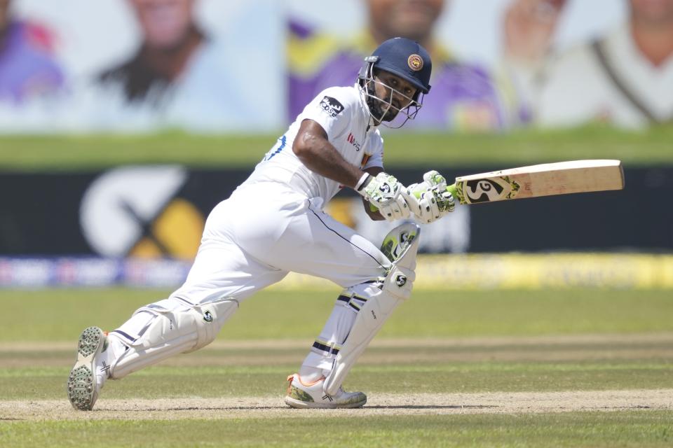 Sri Lanka's Dimuth Karunaratne plays a shot during the day one of their first test cricket match with Australia in Galle, Sri Lanka, Wednesday, June 29, 2022. (AP Photo/Eranga Jayawardena)