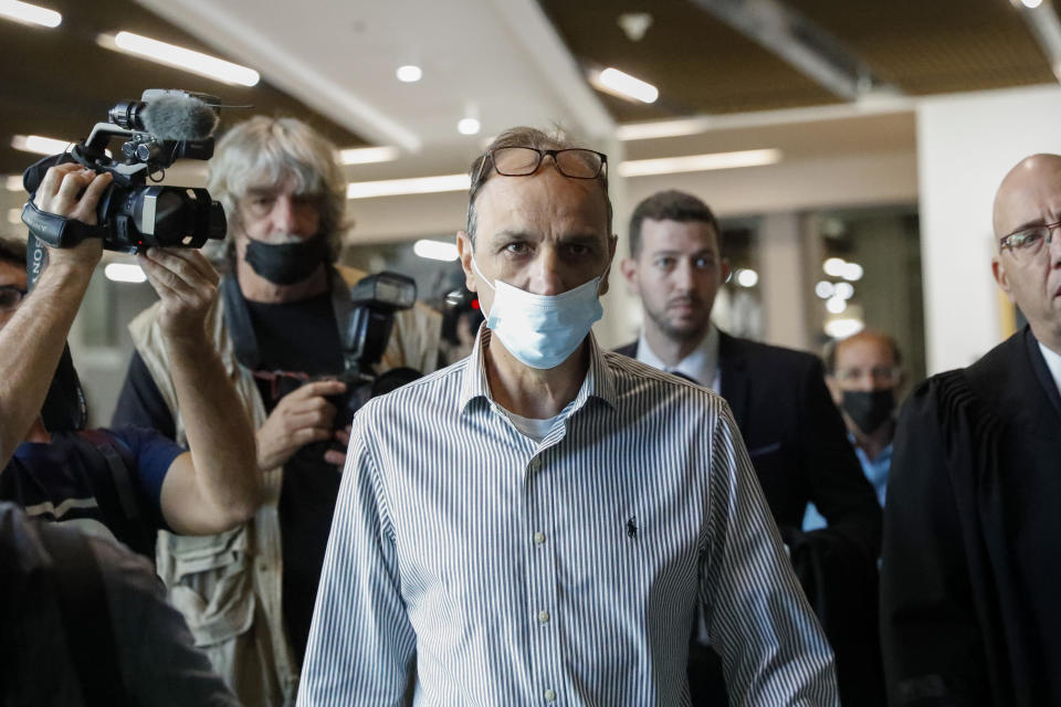 Shmulik Peleg, grandfather of Eitan Biran, who survived a cable car crash in Italy that killed his immediate family, arrives to court in Tel Aviv, Thursday, Nov. 11, 2021. (AP Photo/Ariel Schalit)