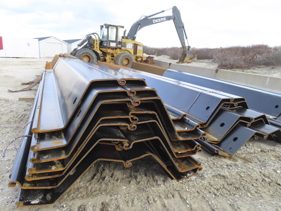 Steel panels to be used in a proposed bulkhead project sit on the beach in North Wildwood, N.J. on Jan. 5, 2023. North Wildwood, which is defying a state order not to do emergency repairs to its eroded beach, is suing New Jersey for $21 million, asserting it has spent that amount trucking sand in to widen its beaches in the absence of a government beach replenishment project. (AP Photo/Wayne Parry)