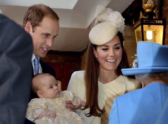 Britain's Queen Elizabeth II, right, speaks with Prince William and Kate Duchess of Cambridge as they arrive with their son Prince George at the Chapel Royal in St James's Palace, Wednesday Oct. 23, 2013. Britain's 3-month-old future monarch, Prince George will be christened Wednesday with water from the River Jordan at a rare four-generation gathering of the royal family in London. (AP Photo/John Stillwell/Pool)