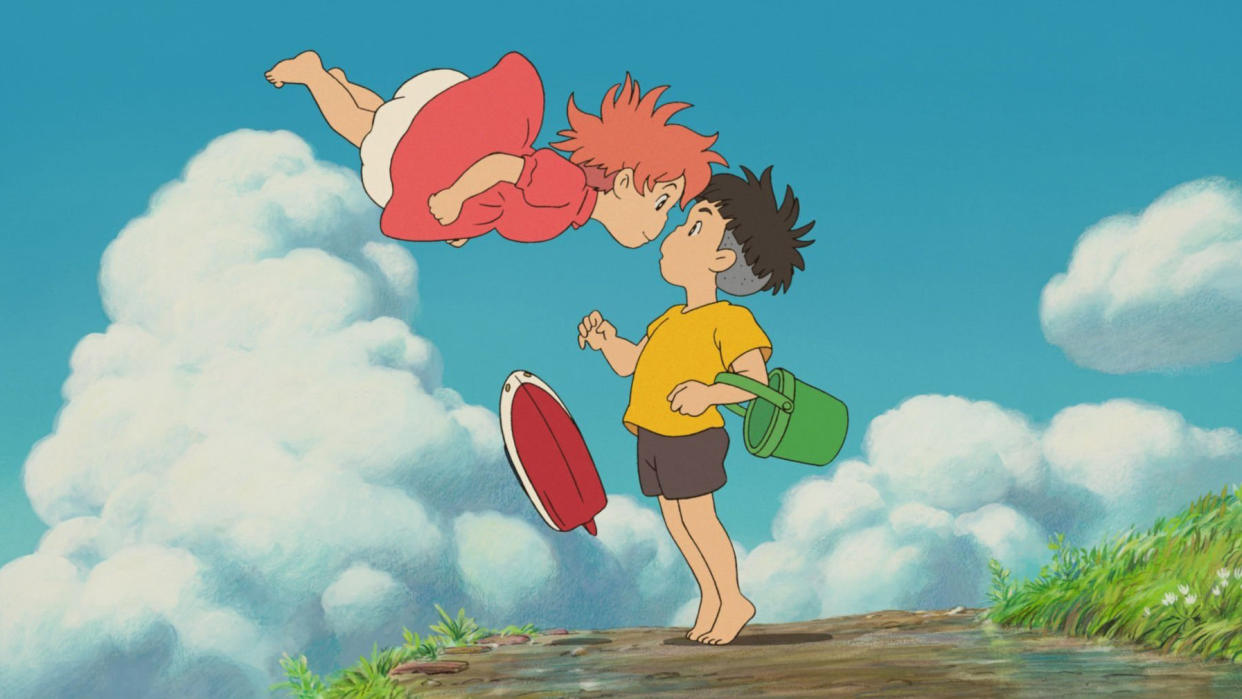  A still from the movie Ponyo from Studio Ghibli, one of the best Max family movies, showing the character Ponyo/Brunhilde flying in the air face to face with Sōsuke. 