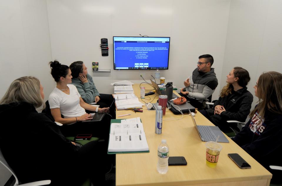 Students gather Oct. 18 to study nursing in one of the open pods in The Frank and Maureen Wilkens Science and Engineering Center on the Cape Cod Community College campus in West Barnstable. Merrily Cassidy/Cape Cod Times