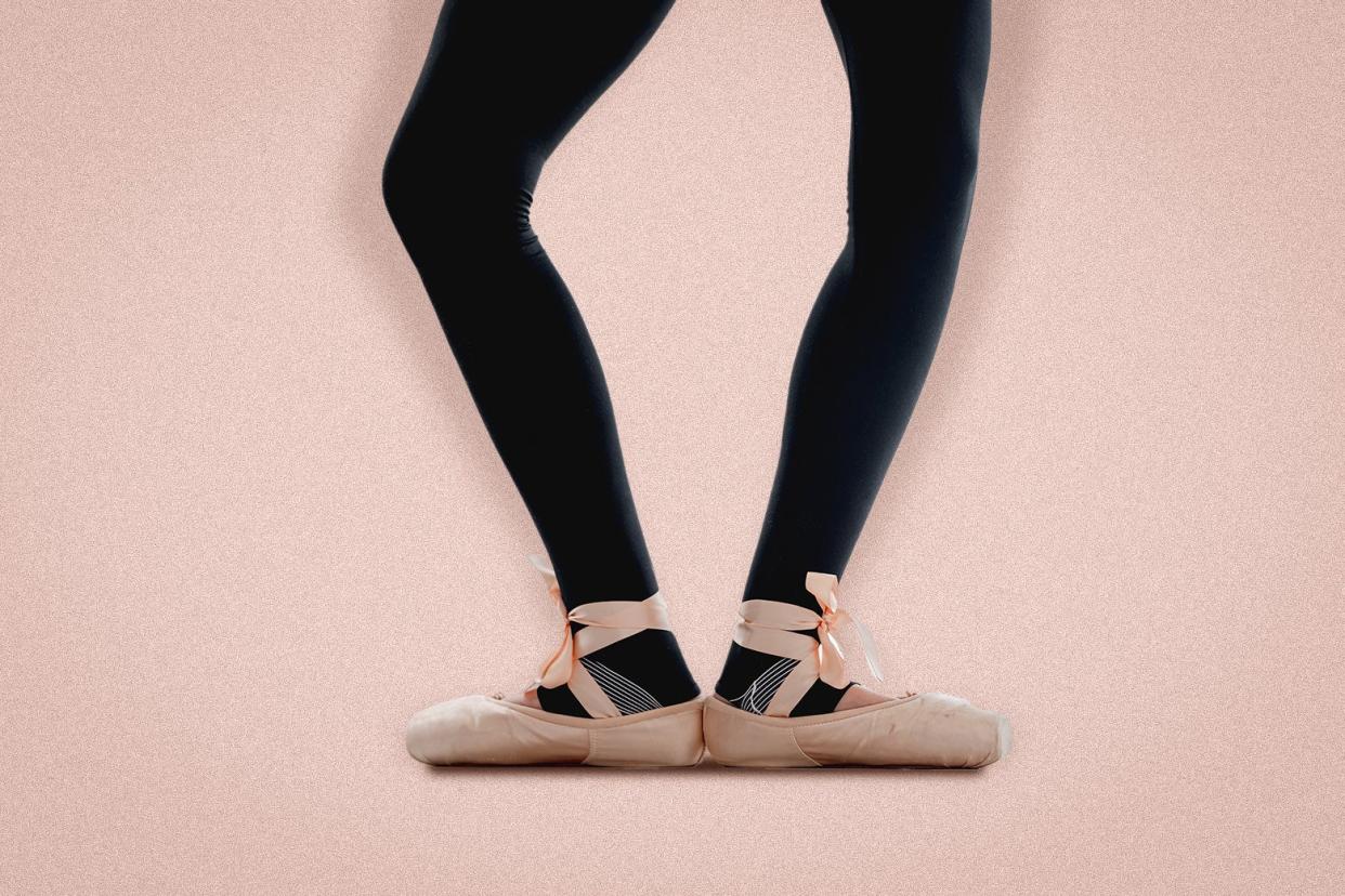 An imperfect, asymmetrical plié is performed by legs in tights and feet in pink ballet slippers.