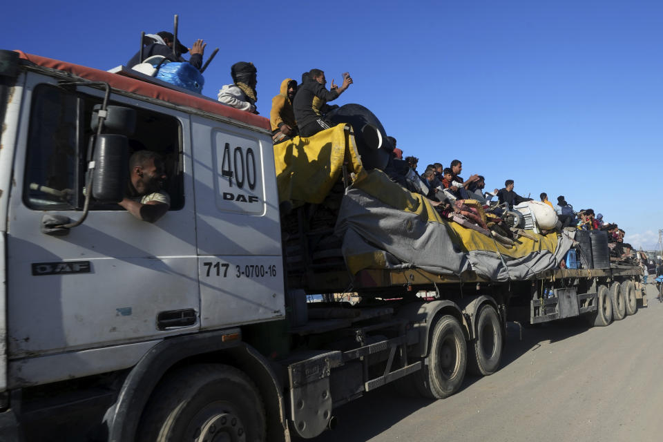 Palestinians flee the Israeli ground offensive in the central Gaza Strip, heading south through Deir al BalahFriday, Jan. 5, 2024. (AP Photo/Adel Hana)