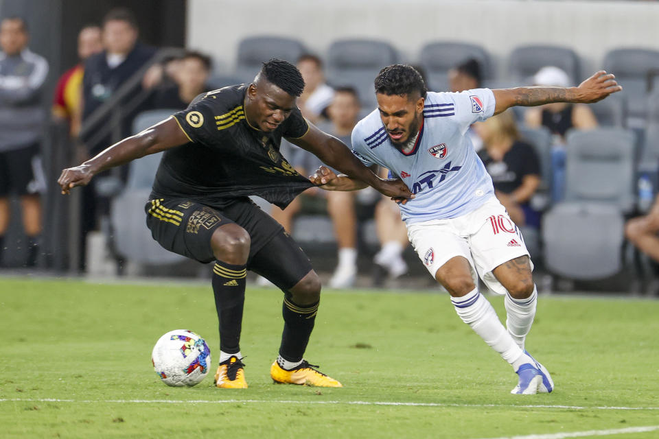 Los Angeles FC defender Jesus David Murillo, left, and FC Dallas forward Jesus Ferreira vie for the ball during the first half of an MLS soccer match in Los Angeles, Wednesday, June 29, 2022. (AP Photo/Ringo H.W. Chiu)